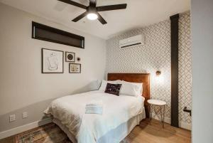 a bedroom with a bed and a ceiling fan at Walkable Urban Tennyson St Apt - Steps to Eats in Denver