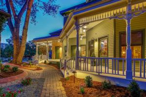 a house with a porch and a walkway at Pinky's Palace - Curtis Park Club - RiNo in Denver