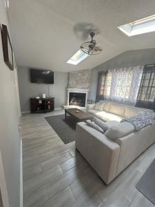 a living room with a couch and a fireplace at Robin's Nest Savannah in Savannah