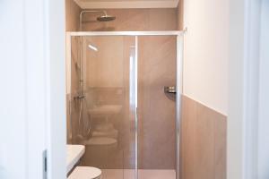 a bathroom with a shower and a toilet at Locanda del Persico in Morbio Inferiore +29 photos