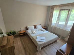 a bedroom with a bed and a large window at Villa Ribarica in Ribarica +32 photos