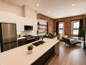 an open kitchen and living room in a loft at The Post Hotel in Renfrew