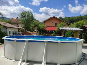 a large swimming pool in a yard at Villa Ribarica in Ribarica