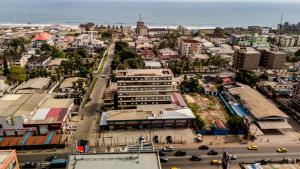 an aerial view of a city with the ocean at Moima Plaza Guesthouse in Monrovia