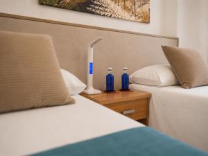 Llit o llits en una habitació de Quiero Cádiz 46 fotos més