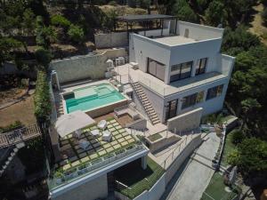 an aerial view of a house with a swimming pool at Villa AmOr in Cefalù