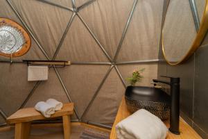 a room with a shower with a mirror and towels at Cascada de las Animas in San Alfonso +39 photos