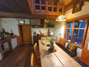an overhead view of a kitchen and a table in a room at Ostaya - Mountain Cottage in Obidza