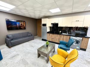 a living room with a couch and a table at Studio plein centre-ville ! in Fez