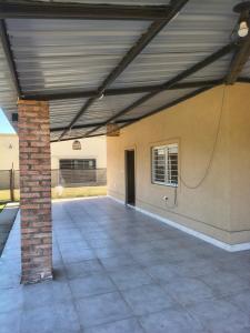 an empty patio with a brick pillar and a building at Finca Las Marías in Cardozos
