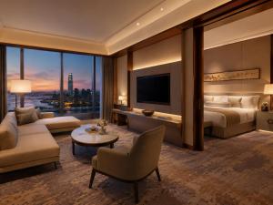 a hotel room with a bed and a tv at Hotel Platinum Square in New Delhi