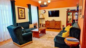 a living room with two couches and a table at Marilyn Apartments in Smederevo
