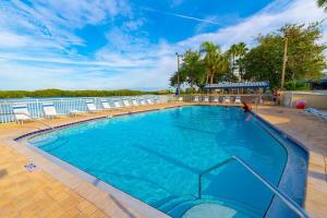 a large swimming pool on a cruise ship at Dolphin & Manatee Cove Condo: Beach Access + More! in Gulf City