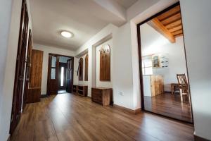a living room with a wooden floor and a hallway at Chata u Mikiho Krahule in Krahule