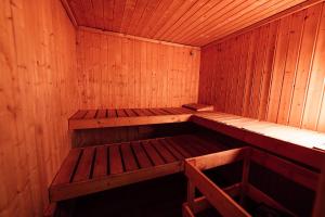 an empty wooden sauna with a bench in it at Chata u Mikiho Krahule in Krahule