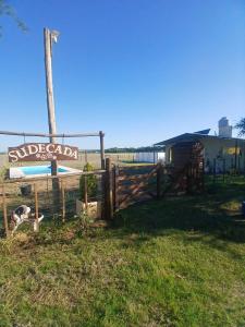 a wooden fence with a sign that reads suborcario street at Sudecada in Toay