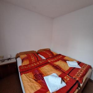 a bedroom with a bed with towels on it at La Verena apartment Terme Čatež in Čatež ob Savi
