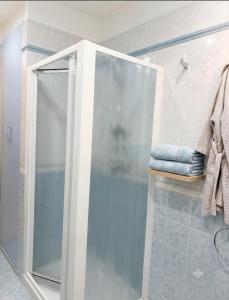 a shower with a glass door in a bathroom at Azzurro Garda in Sirmione