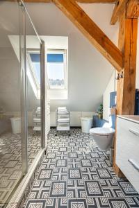 a bathroom with a shower and a toilet at Apartamenty Centrum - Sunshine in Opole +23 photos