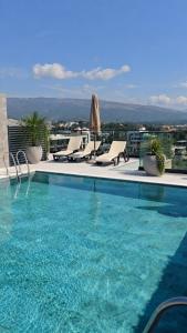 a swimming pool on top of a building at Grand Clochē in Ulcinj
