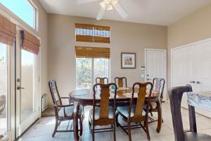 a dining room with a table and chairs at Lovely La Quinta - 66318 in La Quinta