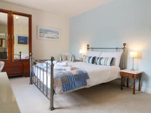 a bedroom with a bed and a chair in it at Sunnyside in Matlock