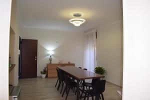 a dining room with a table and chairs at B&B Nonna Matilde in Sapri