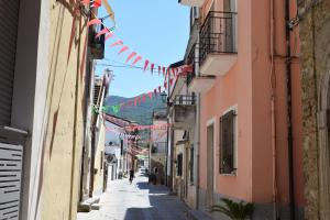 a street in an alley with flags and buildings at B&B Nonna Matilde in Sapri