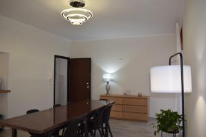 a dining room with a table and chairs at B&B Nonna Matilde in Sapri +7 photos