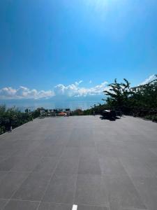 an empty parking lot with a blue sky in the background at Pranvera in Pogradec