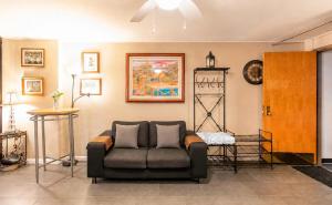 a living room with a couch in a room at Executive Center Hotel Honolulu in Honolulu +22 photos