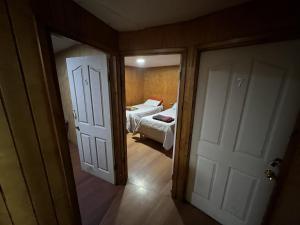 an open door to a bedroom with a bed at Hospedaje Ilabaca in Angol