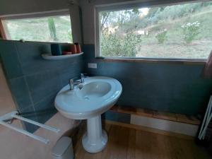 a bathroom with a sink and a window at La Maisonnette Veyronne - Gîte neuf in Aubres