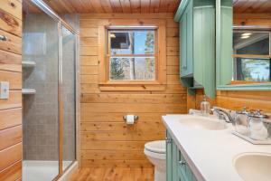 a bathroom with a toilet and a sink and a shower at Pleasant View in Island Falls +39 photos
