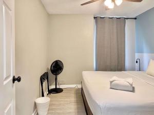 a small bedroom with a bed and a fan at Downtown Condo! Private Balcony! PT10F in Atlanta