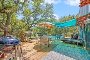 a deck with a hammock and a swing at Three Horses Ranch in Johnson City