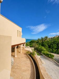 a view of the ocean from a house at The Sanctuary Boutique Hotel in Tangolunda