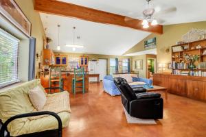 a living room with a couch and chairs and a kitchen at Three Horses Ranch in Johnson City
