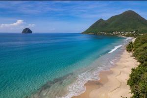 an aerial view of a beach and the ocean at Villa Ma Cherry in Le Diamant