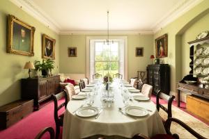a long dining room with a long table in it at Parnacott in Pancrasweek