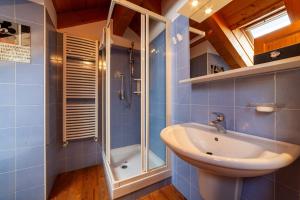a bathroom with a sink and a shower at Residenza Bagni & Miramonti in Cavalese +85 photos