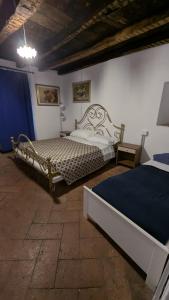 a bedroom with two beds in a room at Antica osteria in Primaluna
