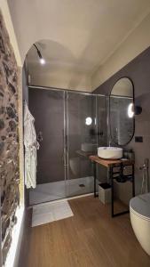 a bathroom with a shower and a sink at Nervia Rooms by Talking Stones in Dolceacqua