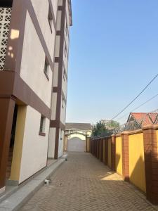 a corridor of a building with a bridge in the background at Zarex homes 1 in Mbale