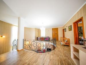 a living room with a bed in a room at guest hause "villa" in Dushetʼi