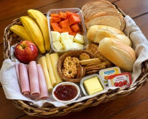 a basket filled with different types of food at Sely Suítes in Ametista do Sul