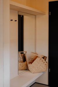 two baskets sitting on a shelf in a closet at Hüttenchalets Rhön in Geisa
