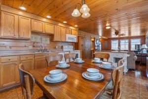 a wooden kitchen with a wooden table and chairs at Echo Motel in Old Orchard Beach
