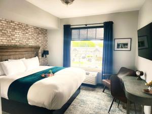 a hotel room with a bed and a window at Waterfront Hotel in Prairie du Chien +68 photos