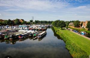 a group of boats are docked in a river at CosyColeby in Nottingham